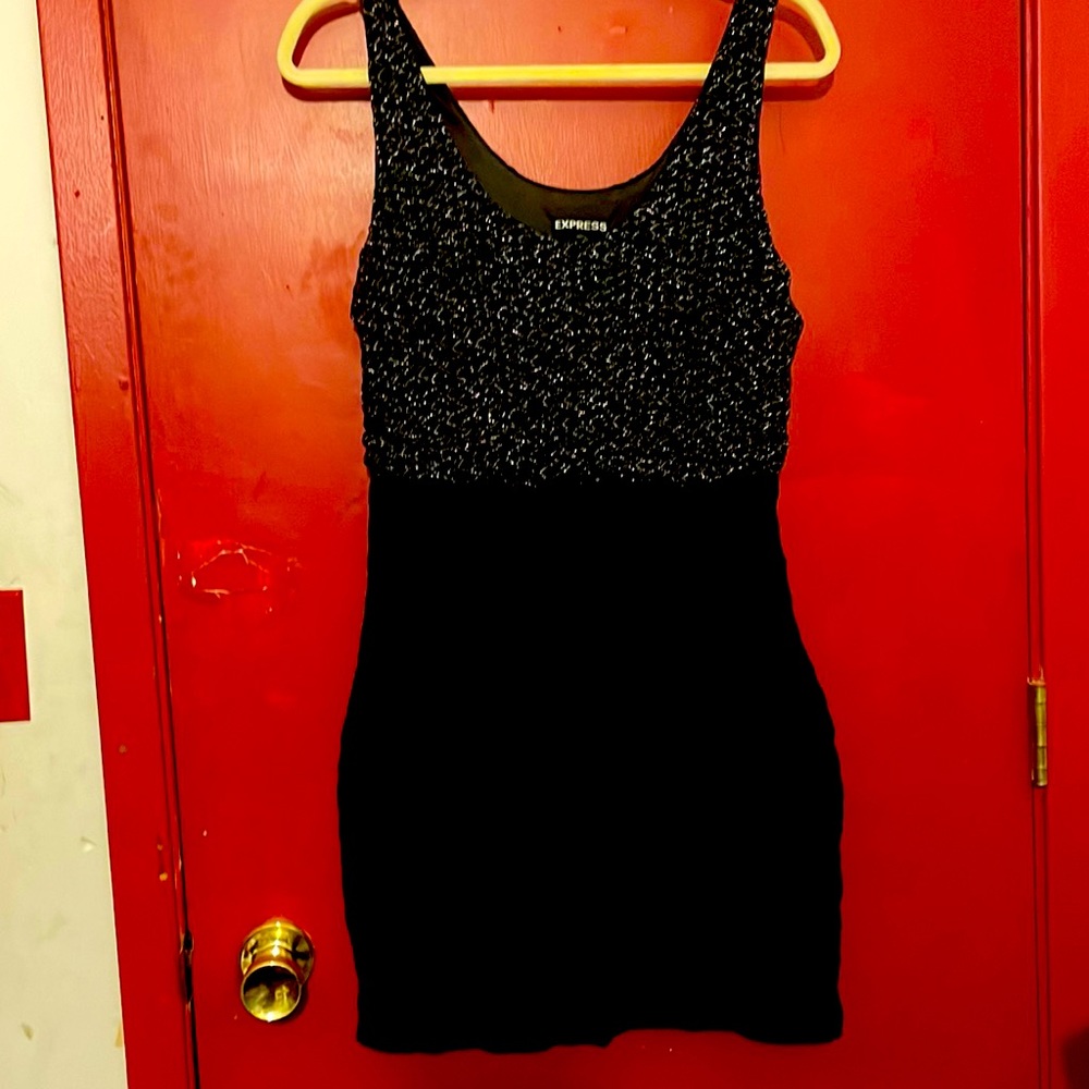 Black slip over dress shirt part is stretches